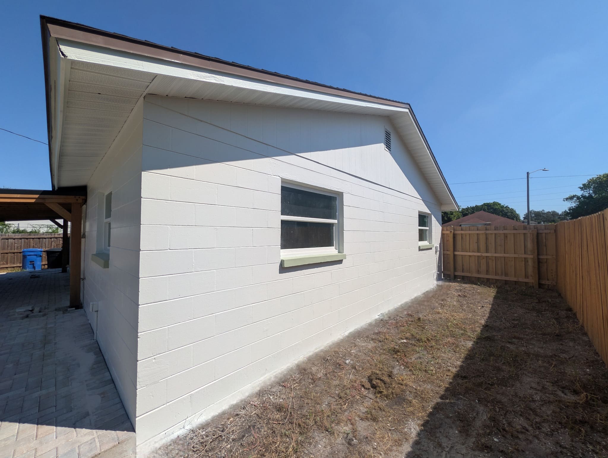 Exterior-Concrete-Block-Home-Painting-White-Finish