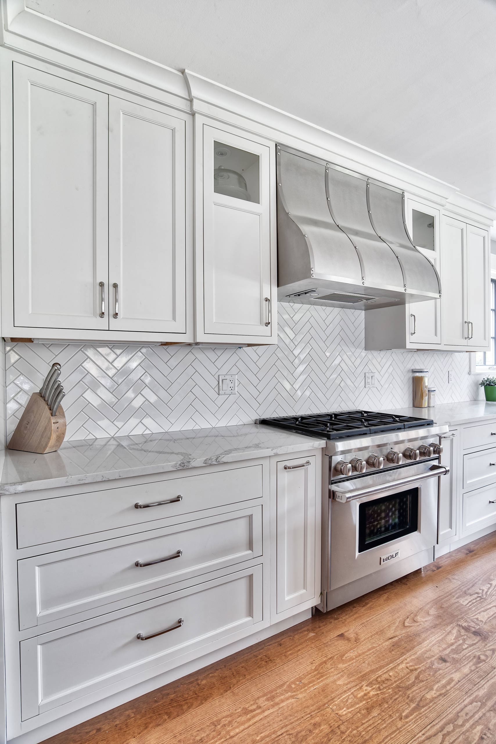 Luxury-White-Kitchen-Cabinets-Herringbone-Backsplash