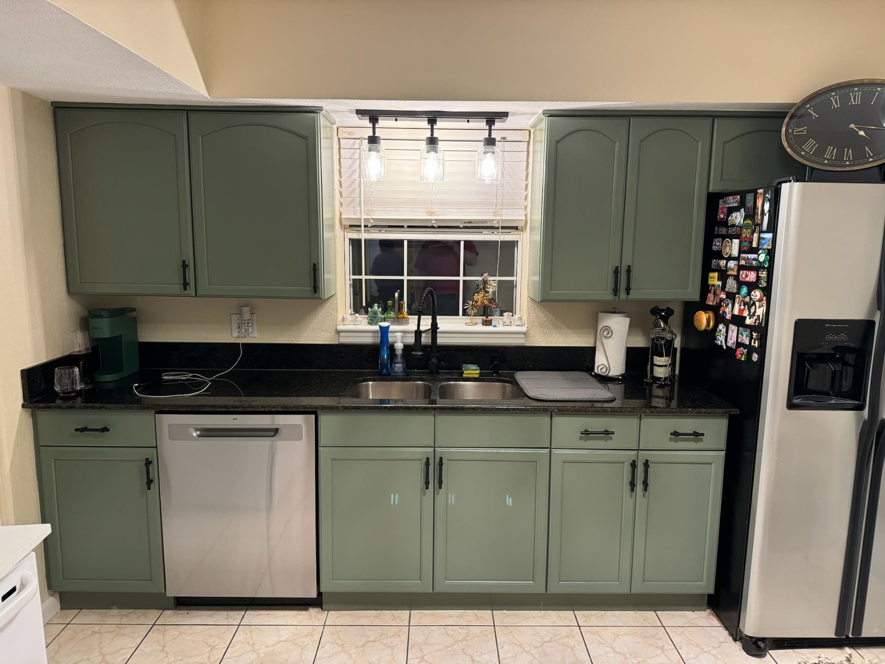 Sage-Green-Kitchen-Cabinets-Black-Countertops