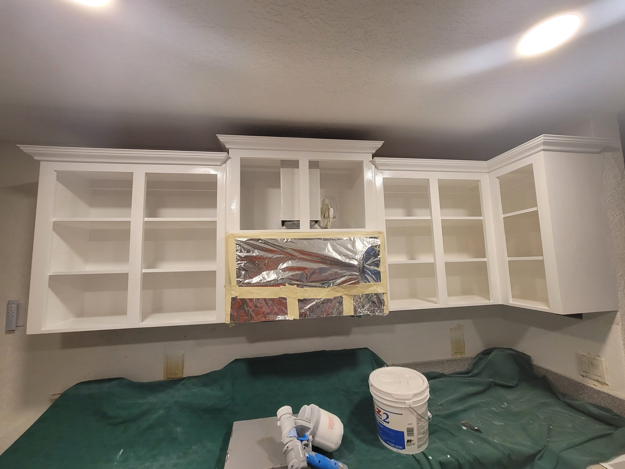 Spray-Painting-Kitchen-Cabinet-Frames-White