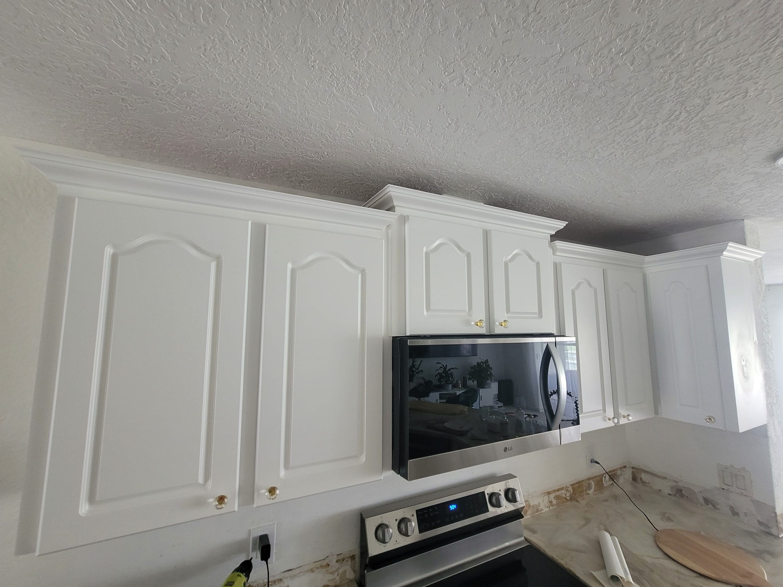 White-Painted-Cathedral-Style-Kitchen-Cabinets
