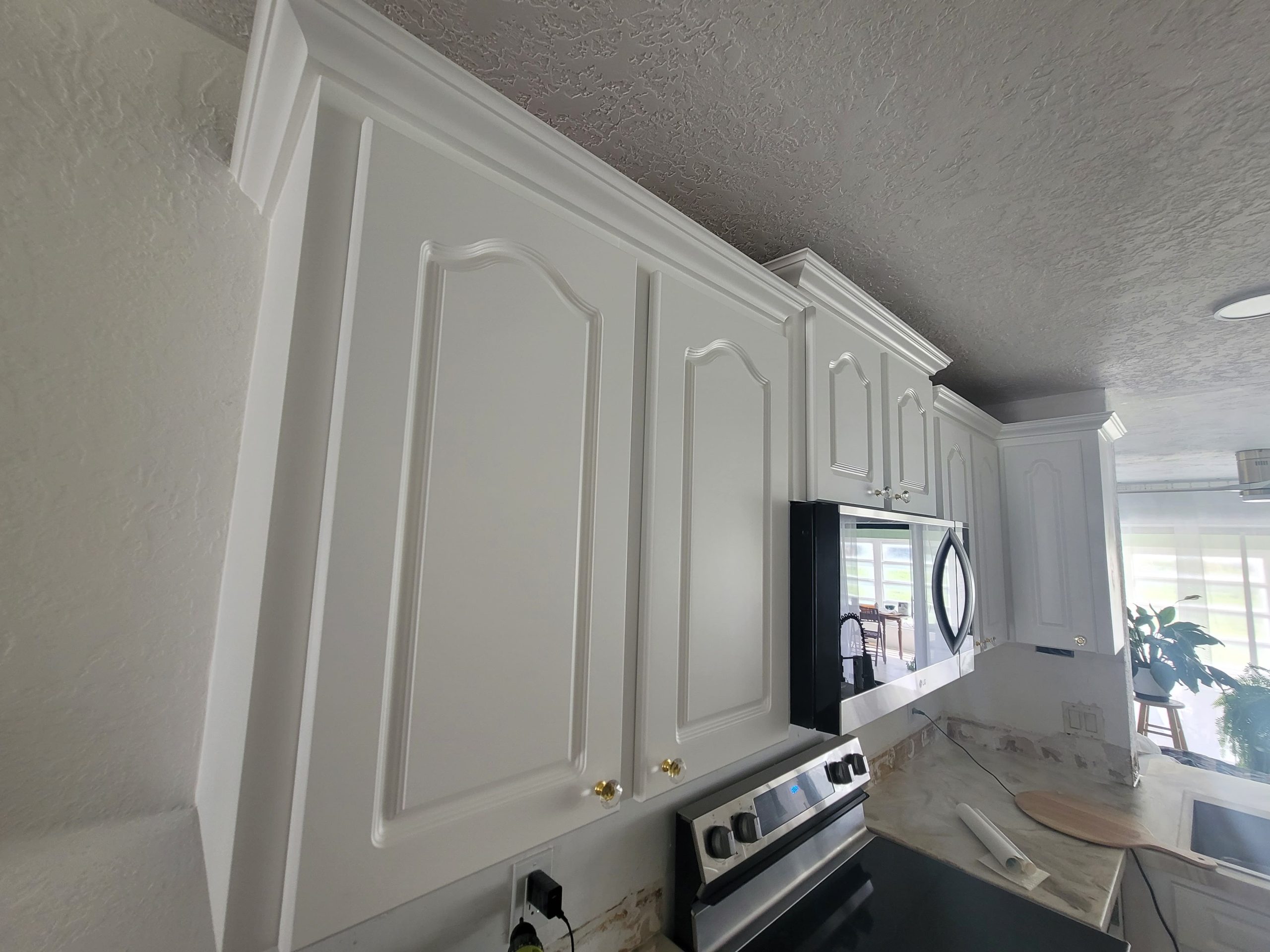 White-Painted-Raised-Panel-Kitchen-Cabinets