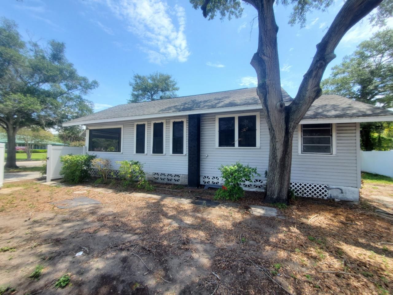 White-Siding-And-Grey-Foundation-Exterior-Paint