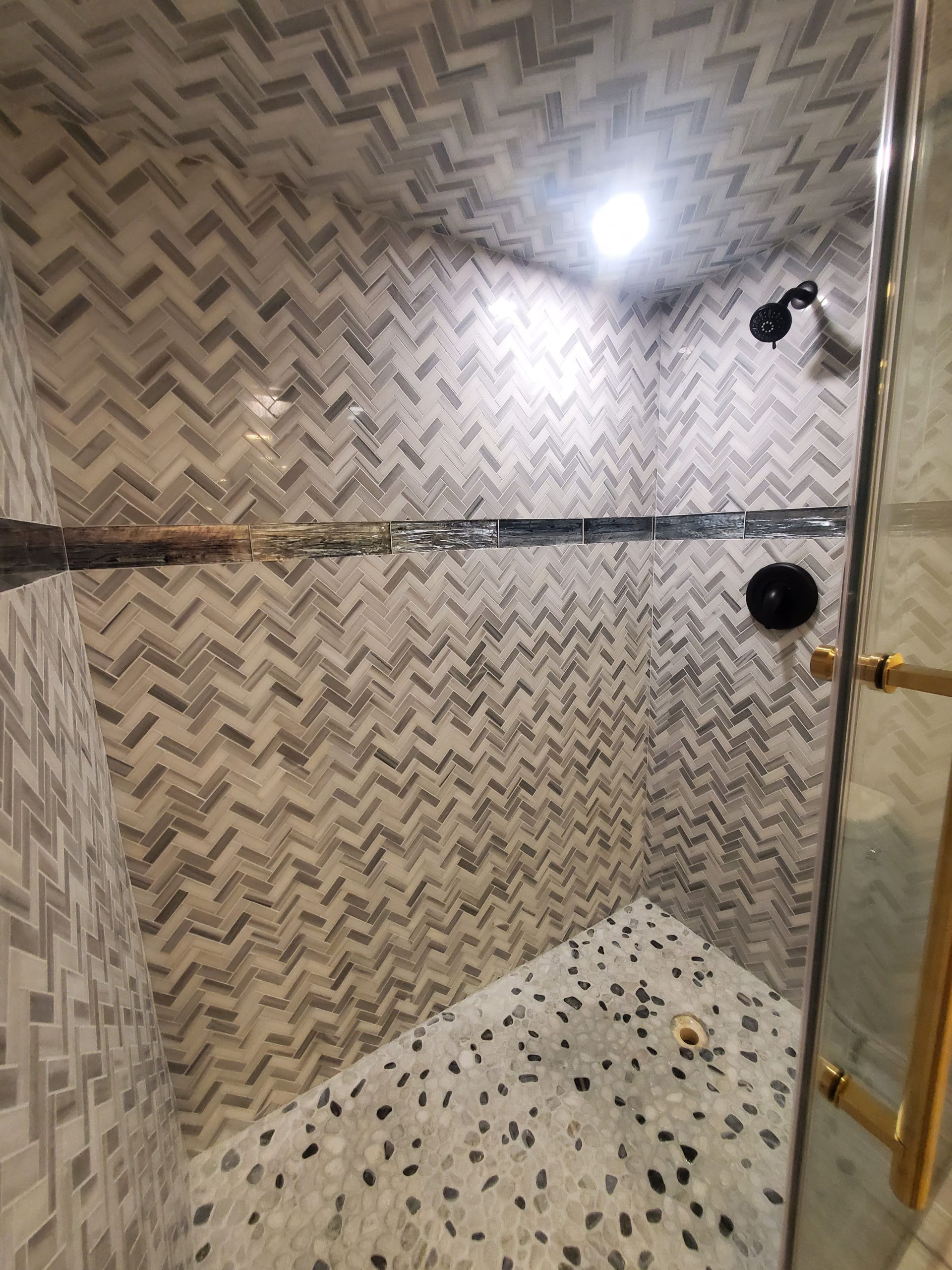 Floor-To-Ceiling-Herringbone-Shower-Tile